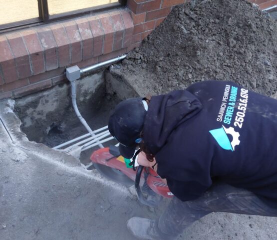 Saanich Peninsual Sewer & Drainage Employee with Company Hoodie