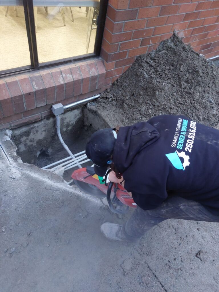 Saanich Peninsual Sewer & Drainage Employee with Company Hoodie